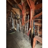 Image 4 : All Yard items on the wall, including pitchforks shovels brooms all sorts of shovels chains 