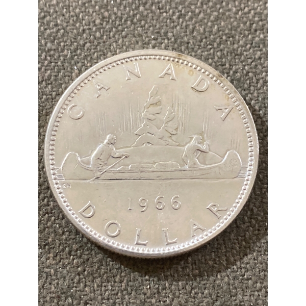 1966 Canadian Silver Dollar Coin Featuring Canoe Design