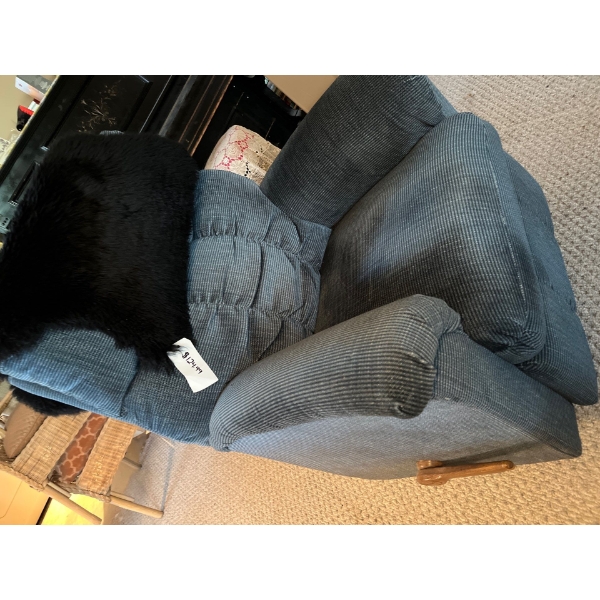Blue La-Z-Boy recliner with wood swivel and a black sheepskin throw retail $124 for the sheepskin th