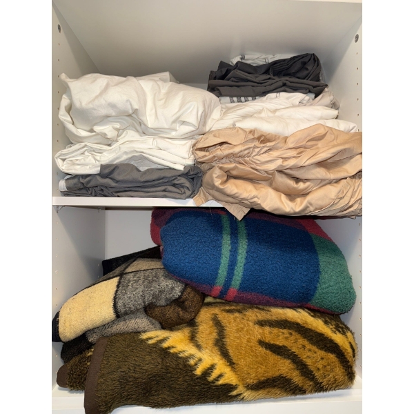 Two Shelves Of Bedding & Blankets