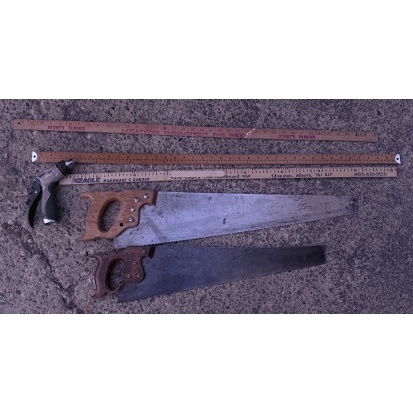 Two Hand Saws with Wooden Handles and Two Wooden Folding Rulers