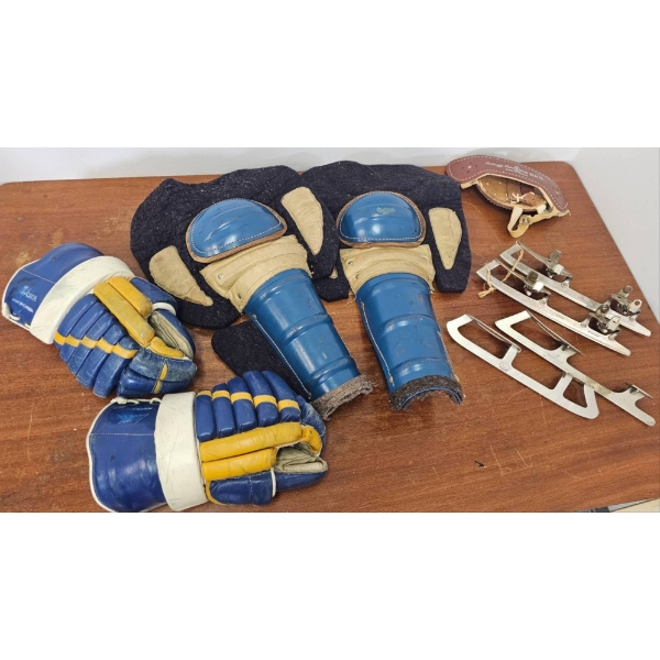 Vintage Ice Hockey Equipment Including Gloves, Pads, and Blades
