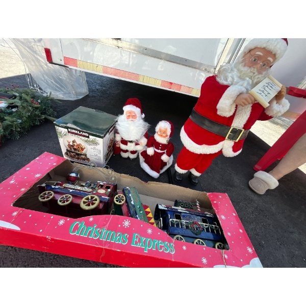 Santa statue 28” and Christmas express train Christmas globe and a small statue set Mrs. Claus and M