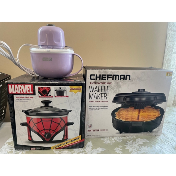 ice cream maker, a marvel crockpot, and a Shefman waffle all in new condition. 