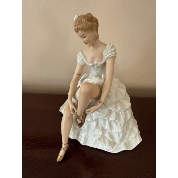 Porcelain Figurine of Seated Ballerina Tying Shoes