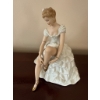 Image 1 : Porcelain Figurine of Seated Ballerina Tying Shoes