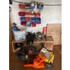 Image 1 :  shelf with contents, including a vintage radio, moving sliders, bolt bins, electric power tools, in