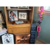 Image 3 : wood cabinet with a number of collectables pictures picture frames. Also sold this one lot.
Includin
