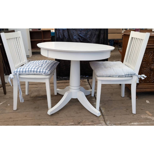Round White Table with Two Chairs and Cushions