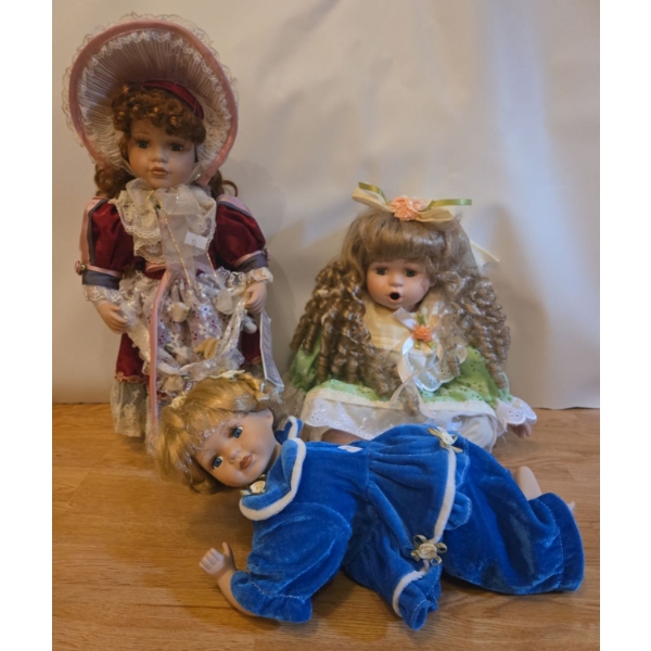 Porcelain Doll Collection: Vanessa, Baby in Blue PJ's, Girl in Green. Tallest is 17T 