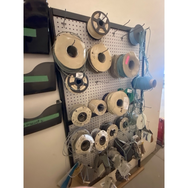 Pegboard Rack with Spools of Wires and Accessories