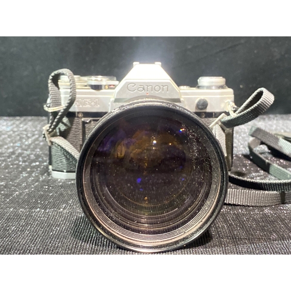 Canon AE-1 Program 35mm SLR Film Camera with a Manual Zoom Lens