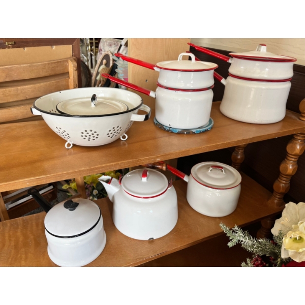 vintage white enamelware colander, likely featuring a black rim and footed base. Large kettle, doubl