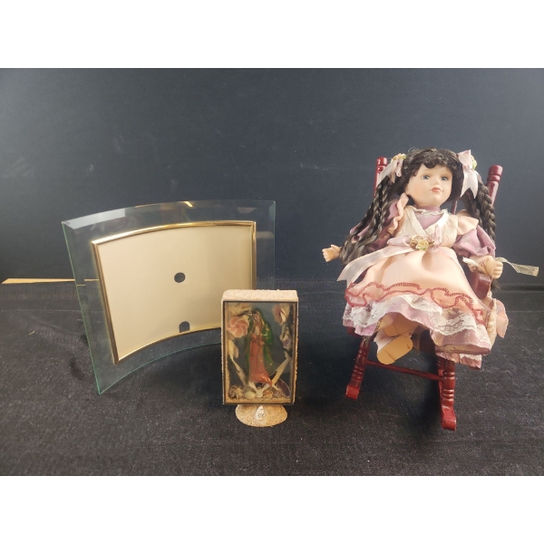 Porcelain Doll on rocker, Mother Mary Art and Curved Glam Frame