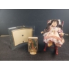 Image 1 : Porcelain Doll on rocker, Mother Mary Art and Curved Glam Frame