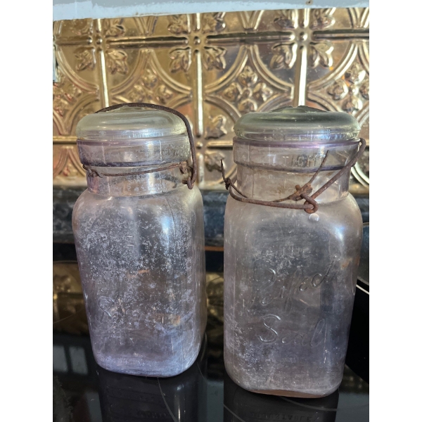 Rare antique perfect seal
purple canning jars with glass tops and metal clasps
Number 4 & 2