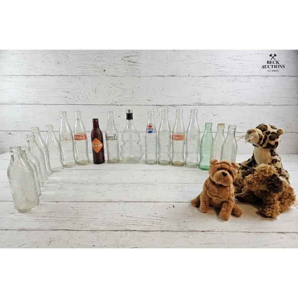 Collection Of Vintage Glass Soda Bottles Coca-Cola, Pepsi, and Crush Mid-20th Century And Plush Toys