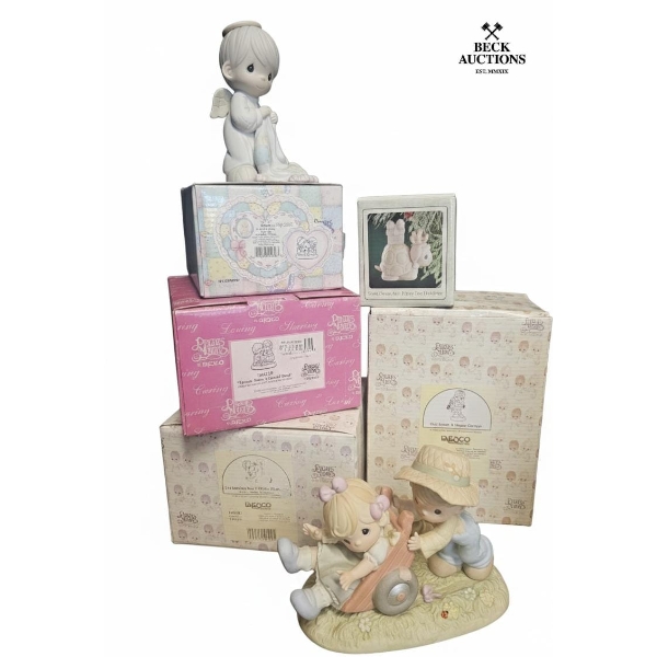 7 Precious Moments figurines Different Size 