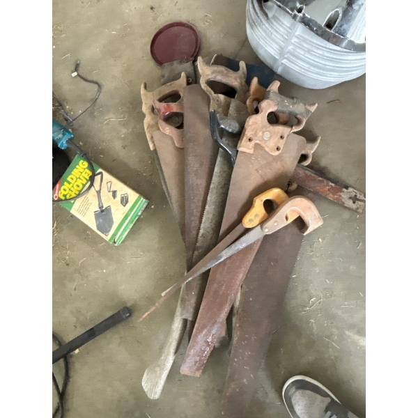collection of hand, saws, and axis of all sizes