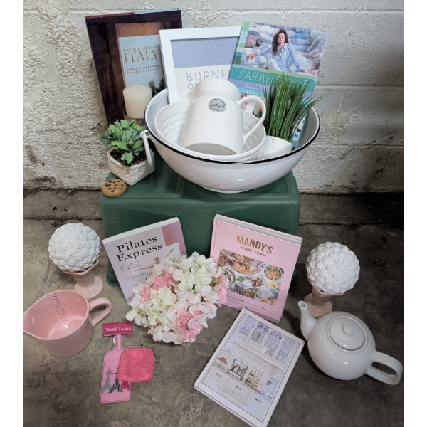 Curated Home Decor and Lifestyle Collection Featuring Books, Ceramics, and Decor Items