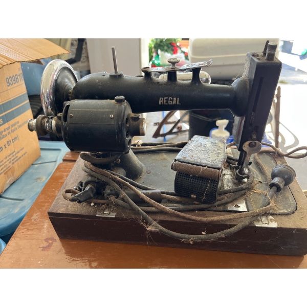two vintage electric sewing machines one Regel and Elmira 120