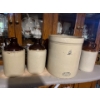 Image 1 :  collection of whiskey, jugs and a number five imperial
Medelta crock made in Alberta