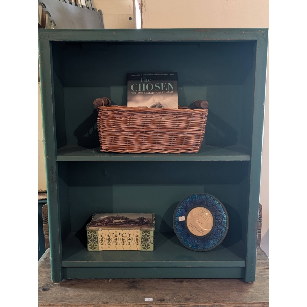 Decorative Items on Green Wooden Shelf