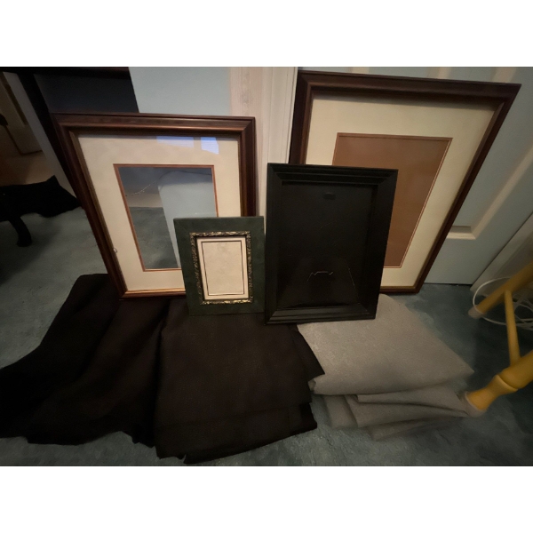 3 sets of curtains with 4 variations sized picture frames .
