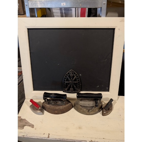 Antique Black Board with Assorted Irons and Trivet
