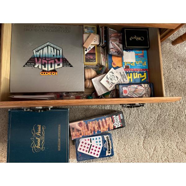  2 drawers filled with a wide assortment of games.