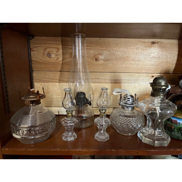 Collection of old vintage Oil Lamps three without glass, one with glass and two miniature oil lamps