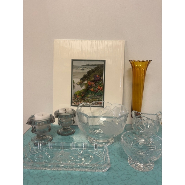 Assortment of decorative glassware, including a tall amber vase and various crystal pieces. Art piec
