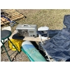 Image 3 : Camping chair, small stool woven RV mat, enamel pot and a Berkeley heater. 

