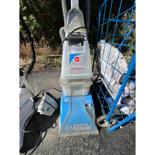 Hoover steam cleaner with Toby, stand-up clothing, steamer, and vintage grocery cart