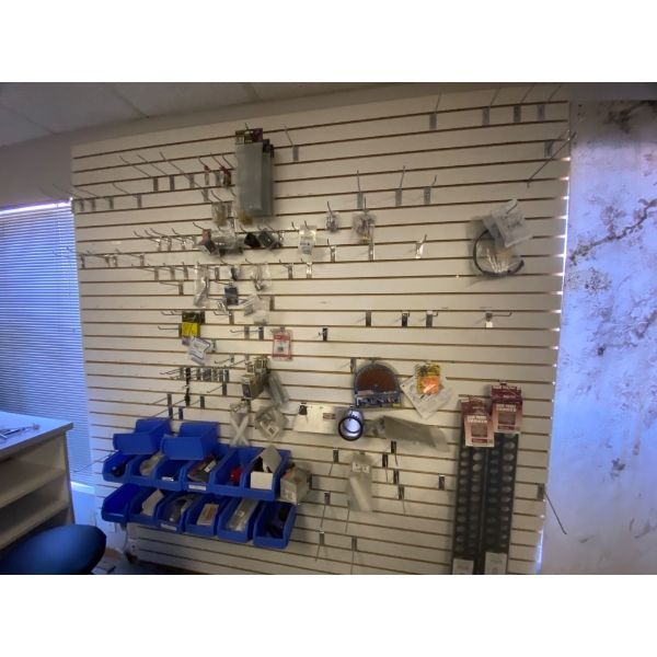 Wall-mounted Rack With Assorted Contents, Including Tools and Accessories
