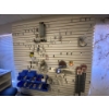 Image 1 : Wall-mounted Rack With Assorted Contents, Including Tools and Accessories