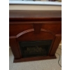 Image 2 : Dark, solid wood electric fireplace tested