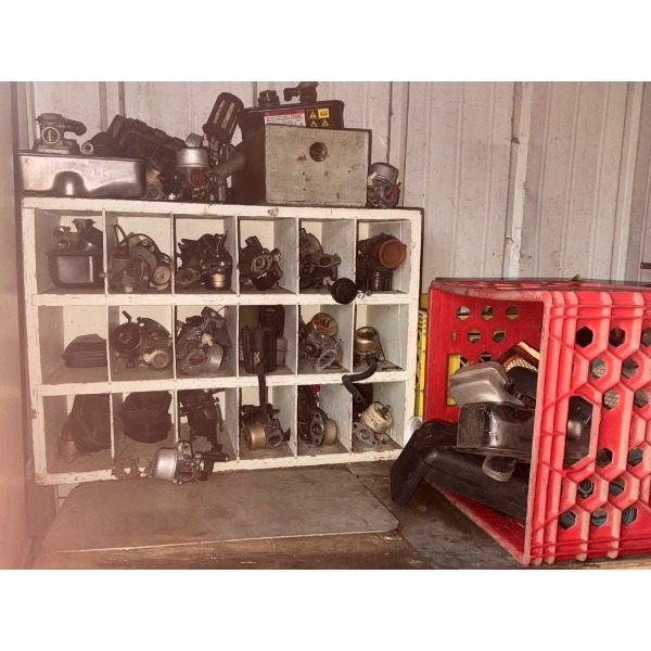 Small Engine Carburetors and Components in Divided Storage Shelf