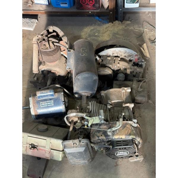 two antique motors, one champion 196 cc motor electric motor and vintage gas tank

