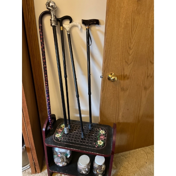 Selection of canes, a shoe rack, and jars of vintage buttons