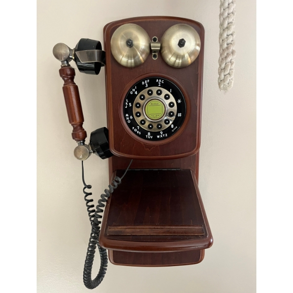 antique style wall hanging phone.