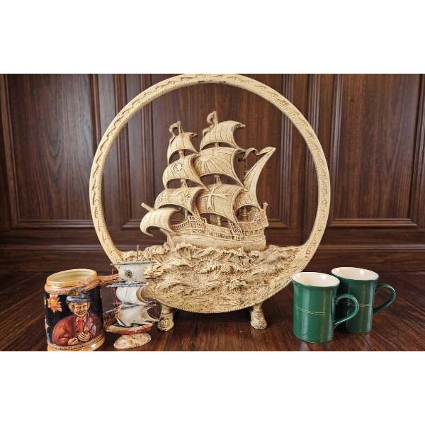 Decorative Nautical Lot with Resin Ship Plaque, Model Sailboat, Stein, and Coffee Mugs