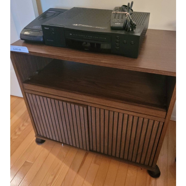 RCA VHS Player with Remotes on Wooden Media Stand