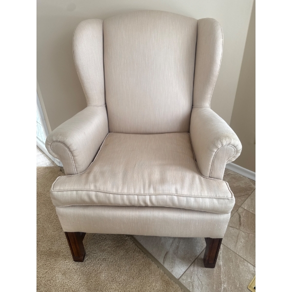 Wingback Armchair With Neutral Upholstery and Wood Legs