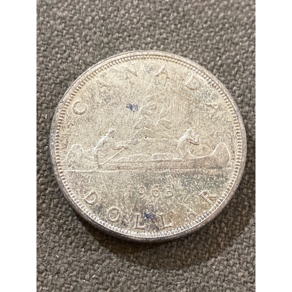 1965 Canadian One Dollar Silver Coin Featuring Canoe Design