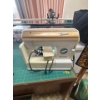 Image 2 :  Brown Omega, sewing machine with quilt hanger, and two small handmade quilts with sewing machine ca