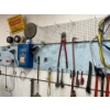Image 1 : Massive Selection Of Tools Hanging on The Wall . Pipe Wrenches Jackall Saws Extension Cords Wrenches