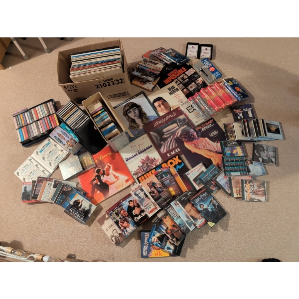 Extensive Collection of Entertainment Media, Including Vinyl Records, CDs, VHS, and Cassette Tapes
