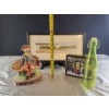 Image 2 : Decorative Delights- Porcelain Figurine, Decorative Bottle, Framed Landscape Bin, and a Tin