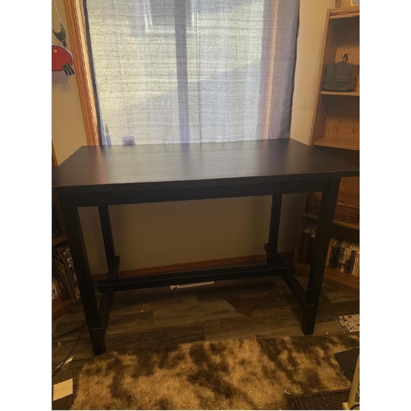 Disassembled Black Metal Table Frame With Wooden Components